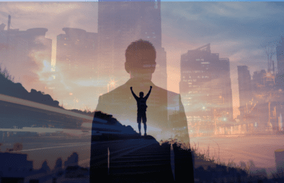 a man celebrating with a skyline as the background